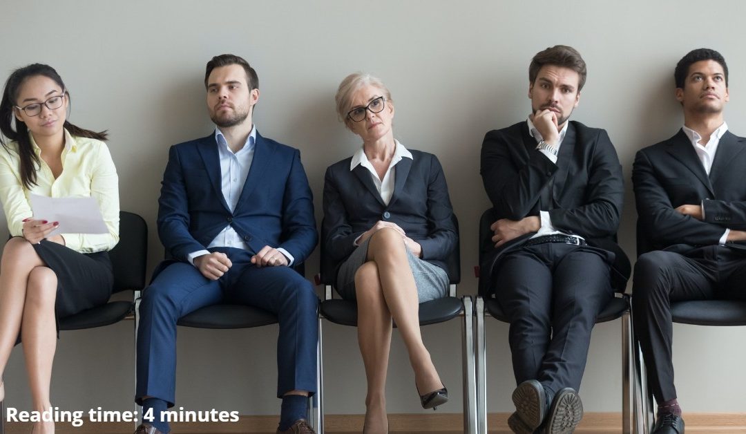 What to do when you are overqualified for a job group of people of mixed ages sitting in a chairs waiting to be interviewed